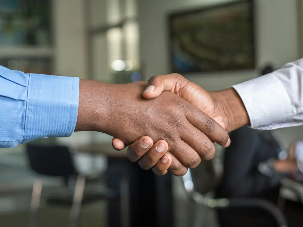 Two business partners shaking hands