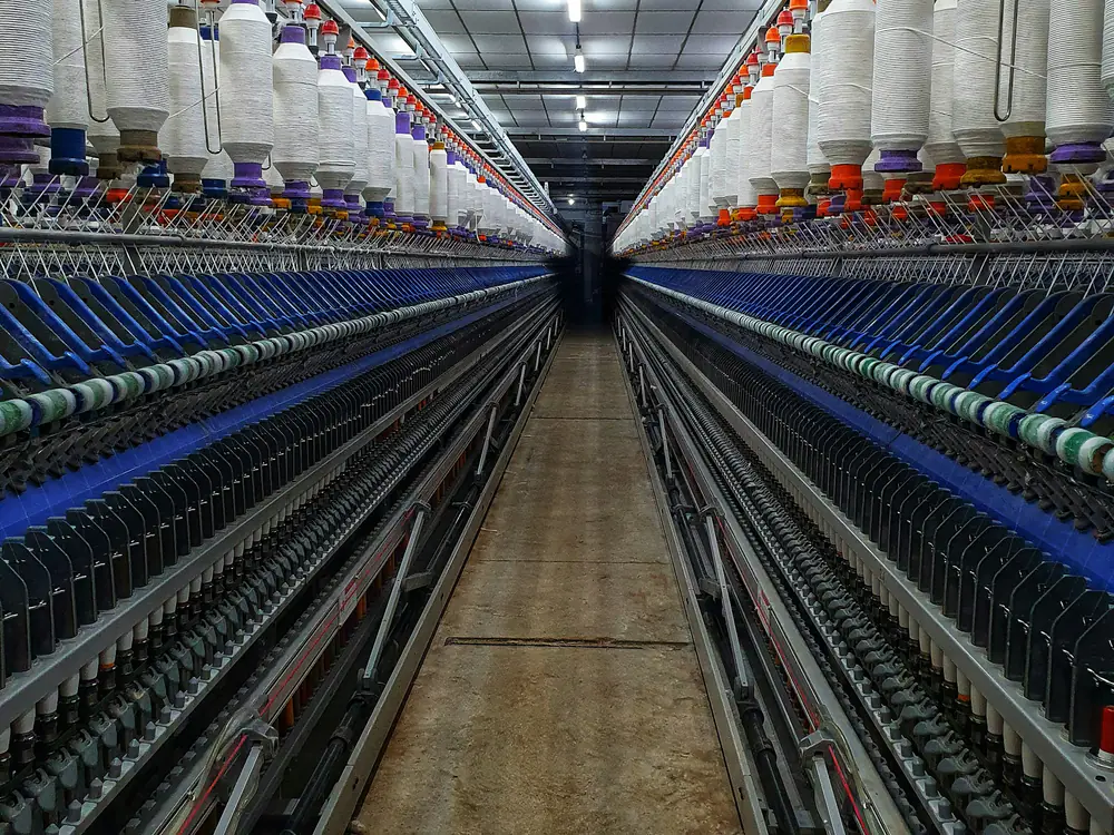 Rows of spinning machines in a textile mill